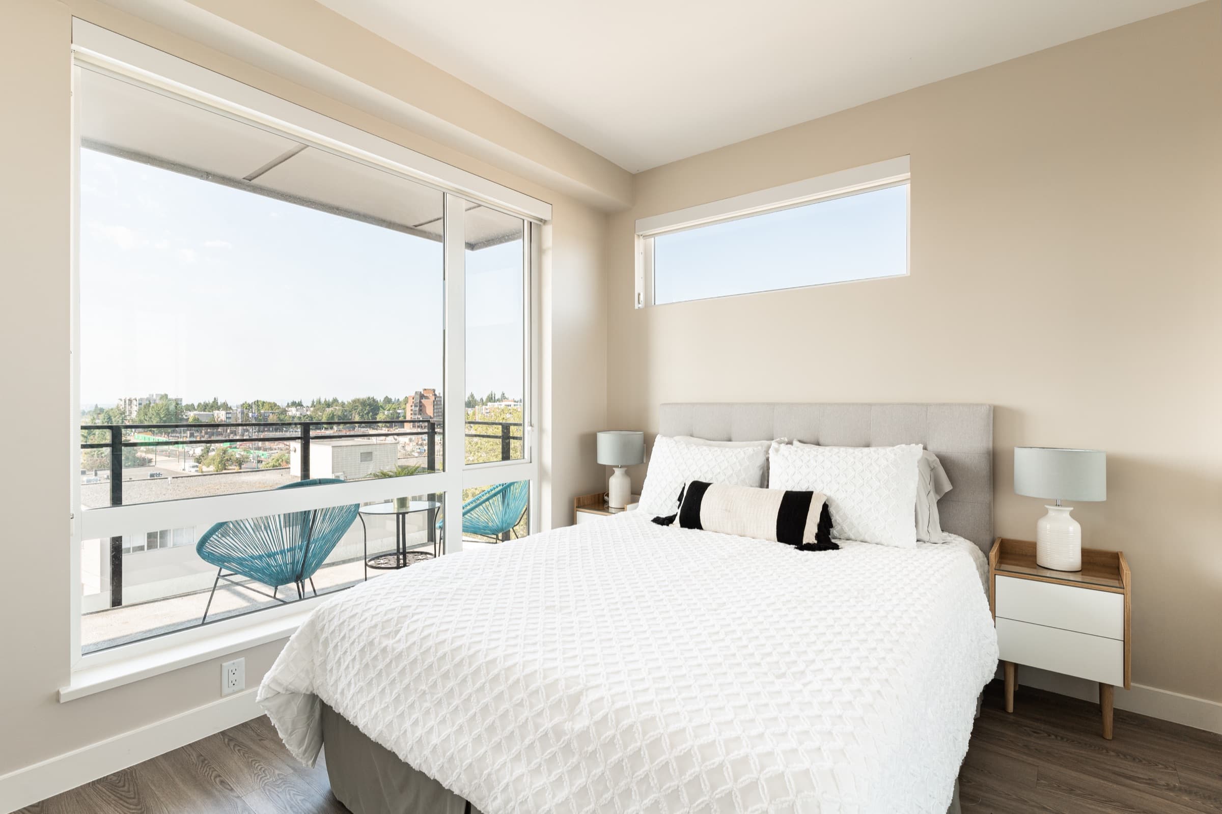 A bedroom at Aria opening onto a private balcony